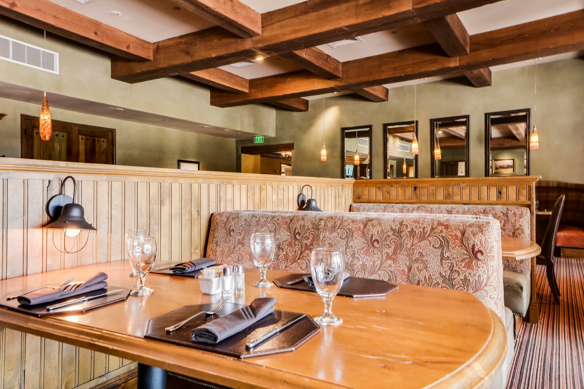 Cimarron Hills Club dining room with wood beam ceiling and booth seating