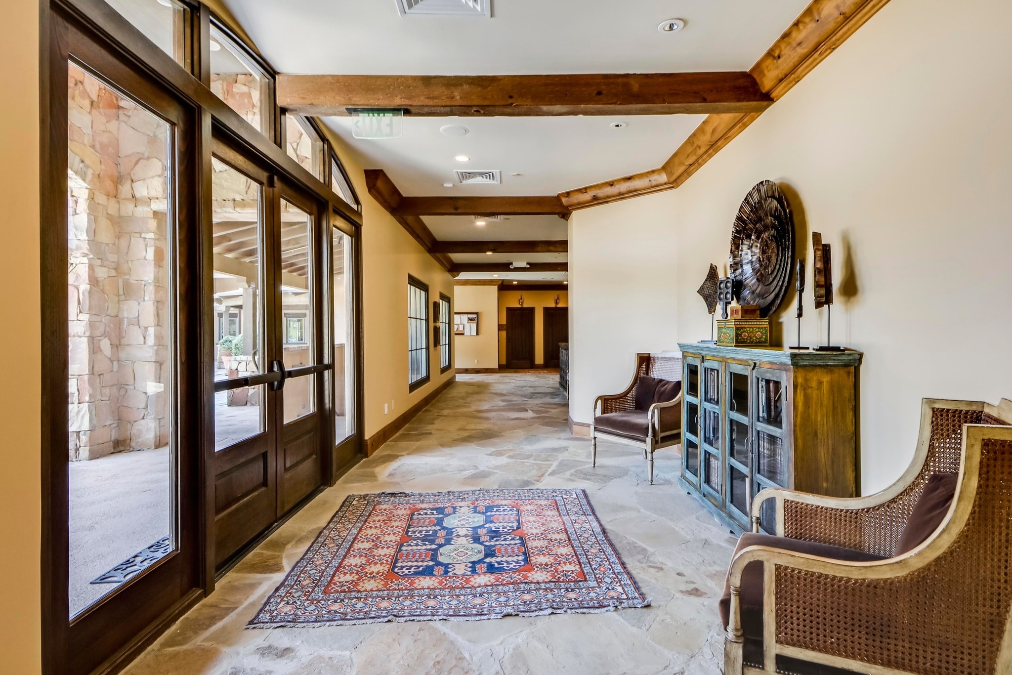 Cimarron Hills Club lobby entrance with stone walls and flagstone floors